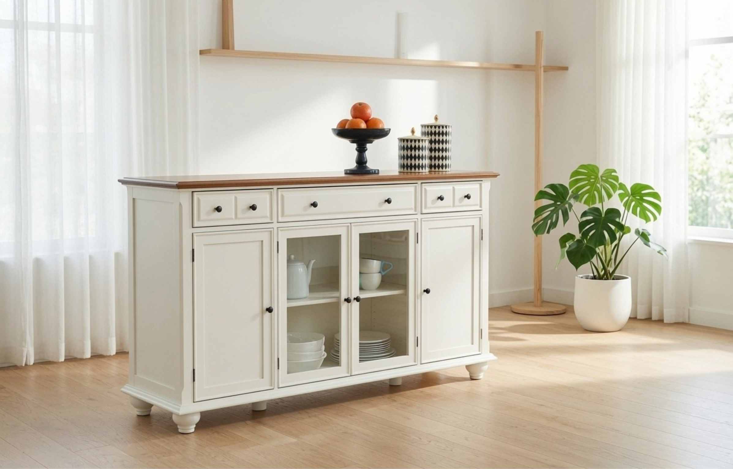 White Buffet Cabinet in a bright living room with plants, sheer curtains, and a wooden floor.